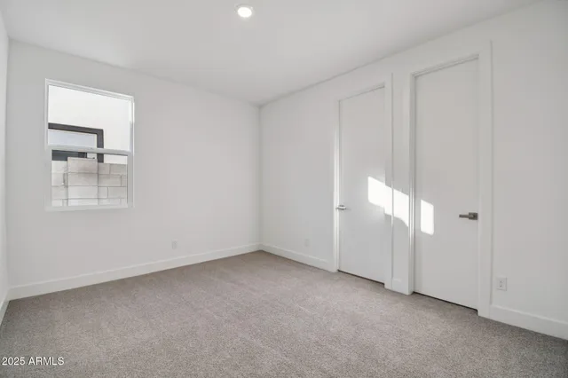 a view of an empty room and a window