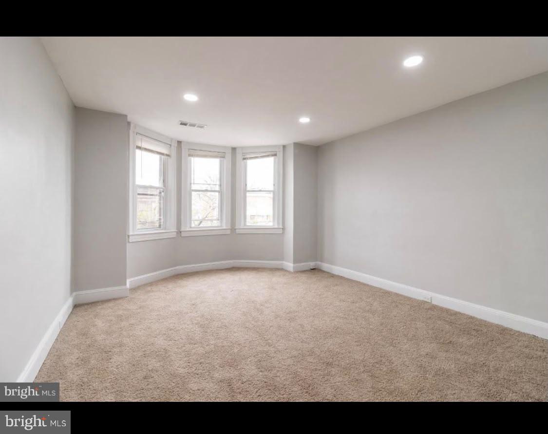 1626 Appleton Street Baltimore, MD 21217 - Photo 18 of 18 a view of an empty room with a window