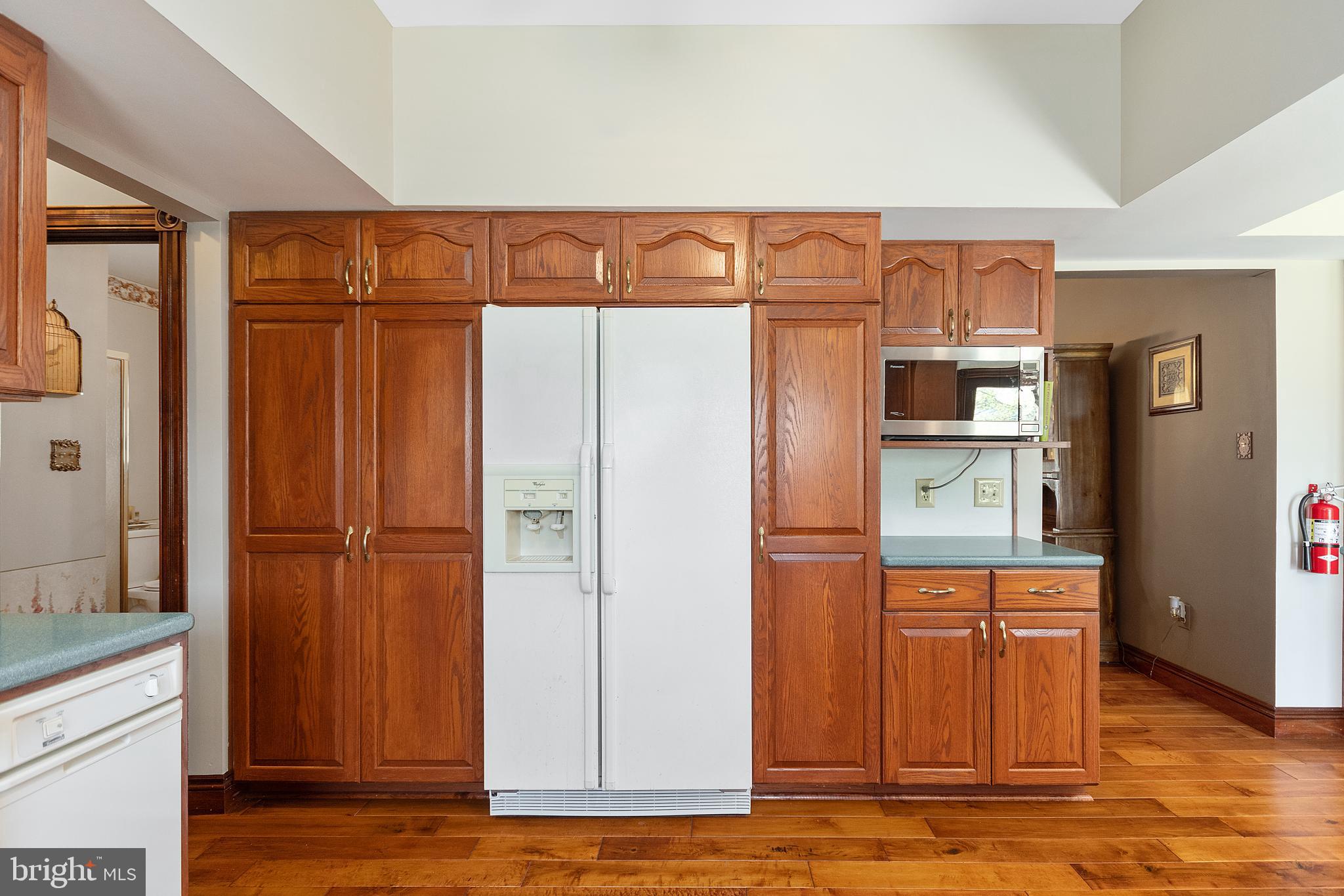 487 Radix Road Williamstown, NJ 08094 - Photo 11 of 36 a kitchen with stainless steel appliances granite countertop a refrigerator and a sink