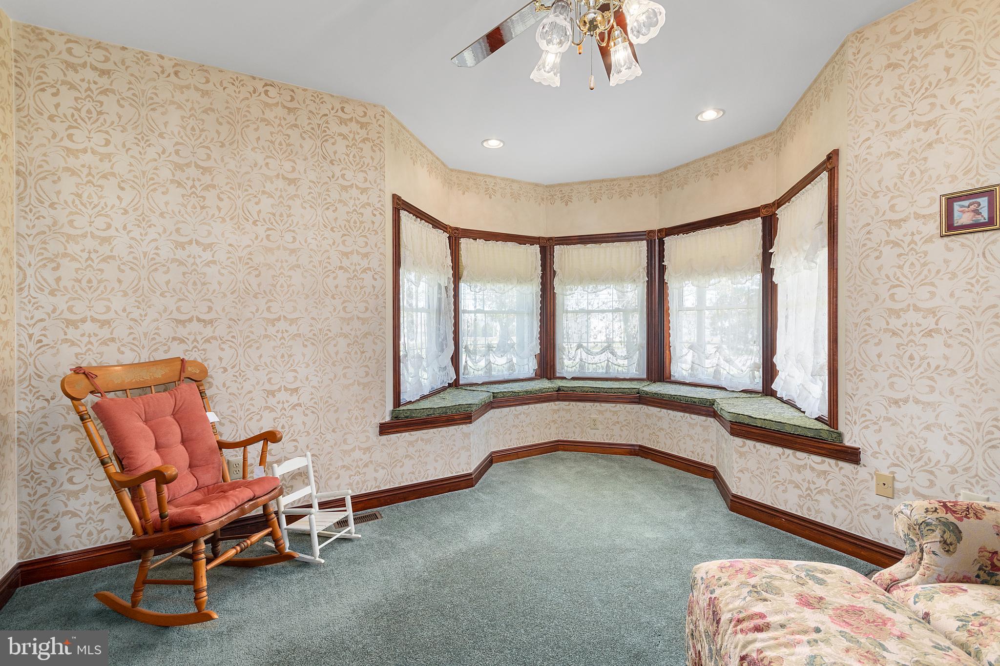 487 Radix Road Williamstown, NJ 08094 - Photo 14 of 36 a spacious bedroom with a bed and a lounge chair