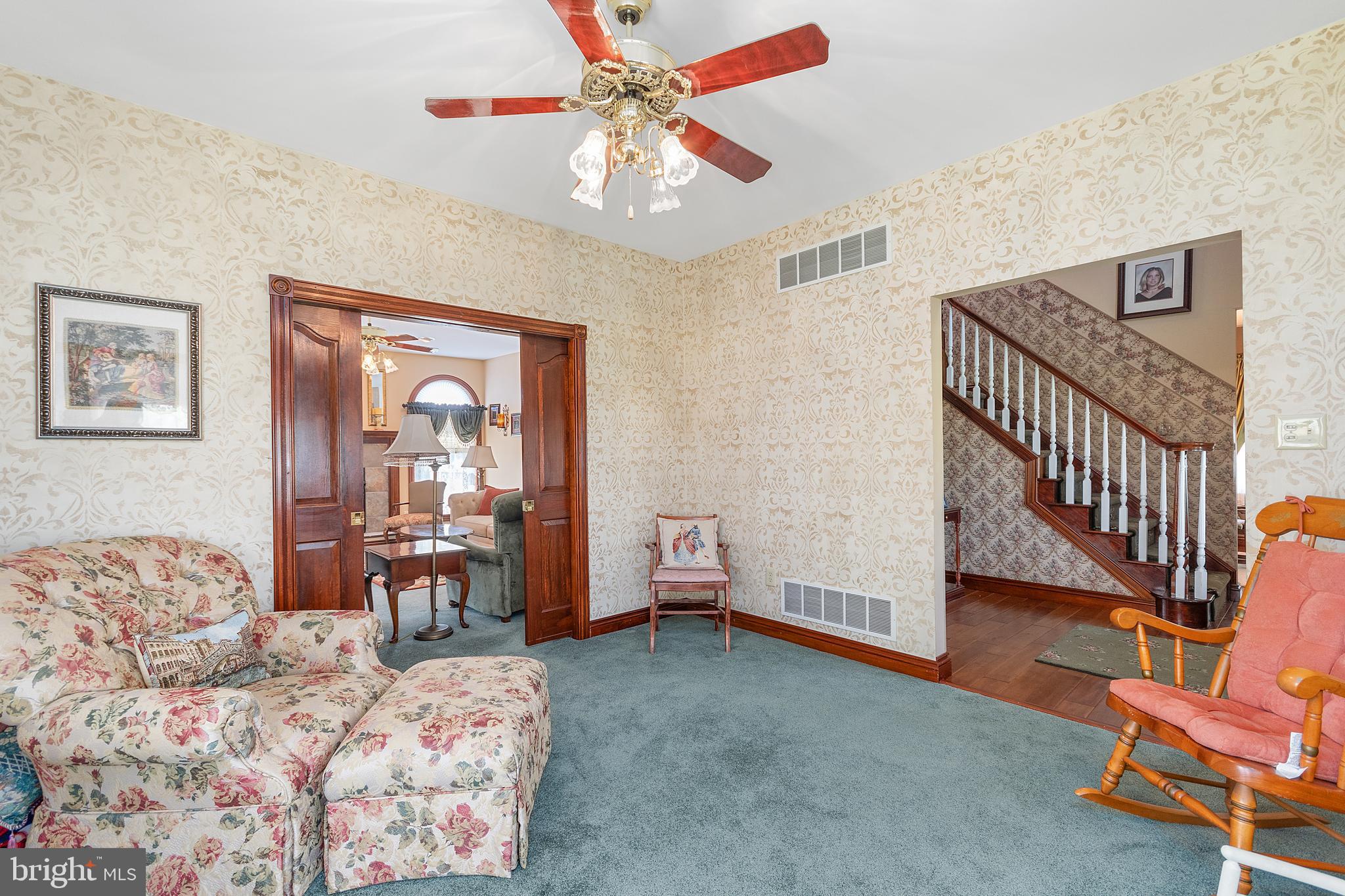 487 Radix Road Williamstown, NJ 08094 - Photo 15 of 36 a living room with furniture and a chandelier