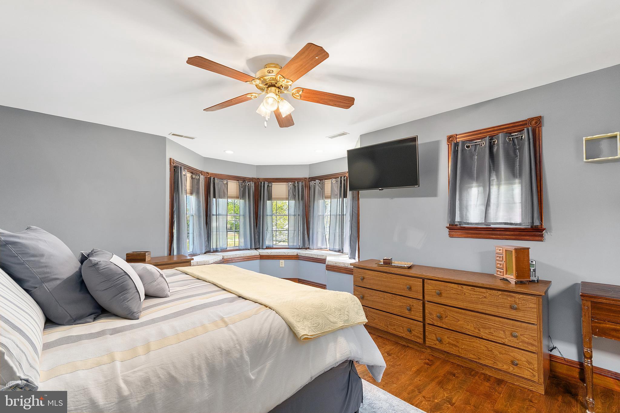 487 Radix Road Williamstown, NJ 08094 - Photo 19 of 36 a bedroom with a bed and a chandelier
