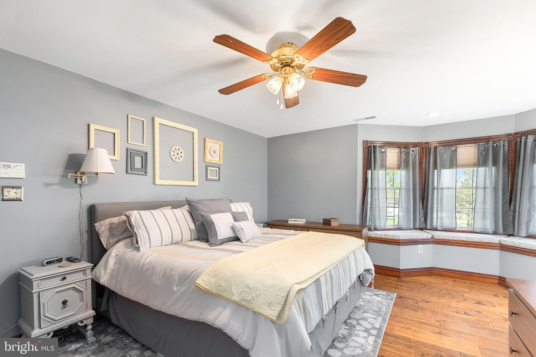 487 Radix Road Williamstown, NJ 08094 - Photo 20 of 36 a bedroom with a large bed and a chandelier