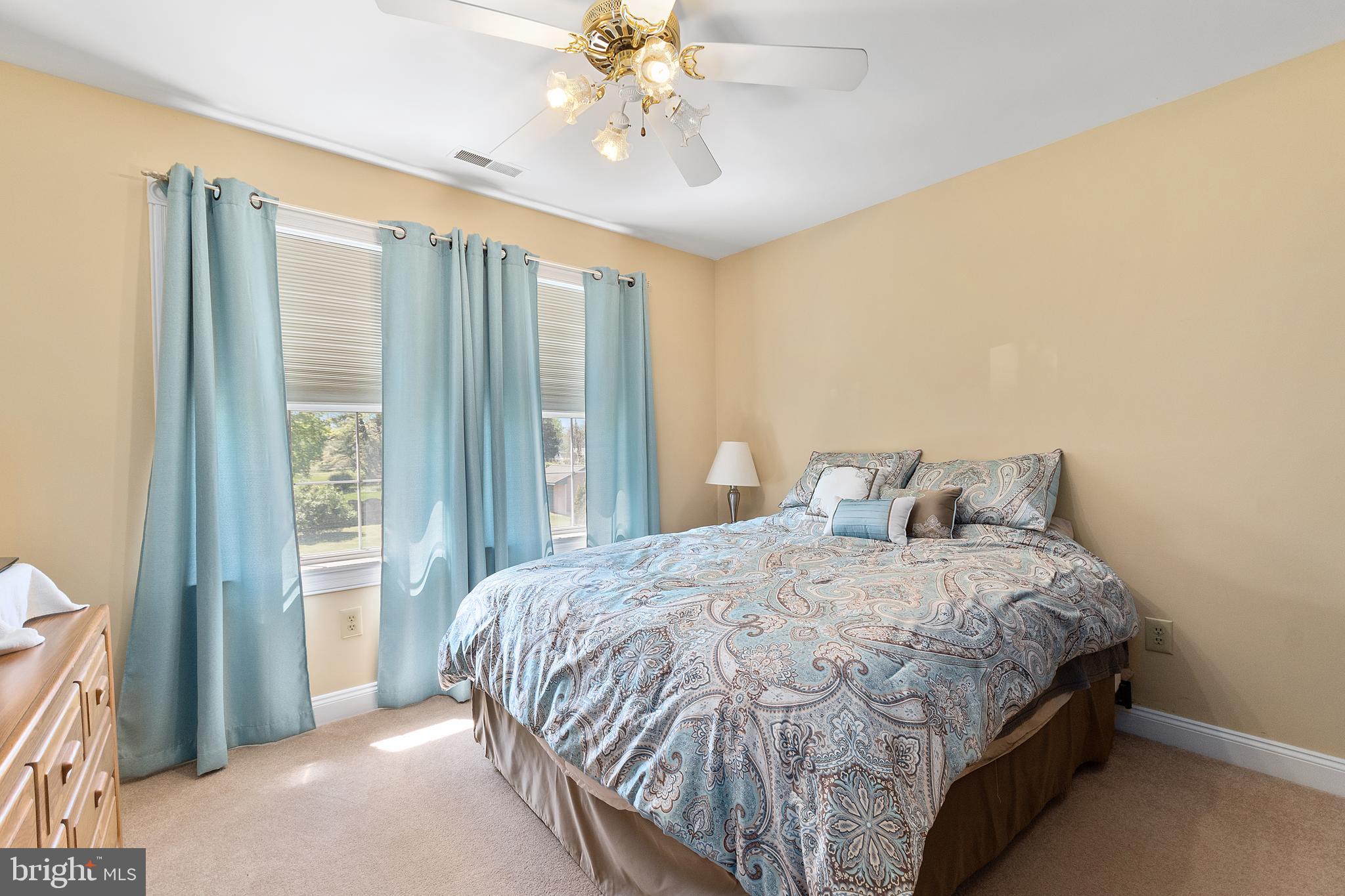 487 Radix Road Williamstown, NJ 08094 - Photo 25 of 36 a bedroom with a bed and a chandelier