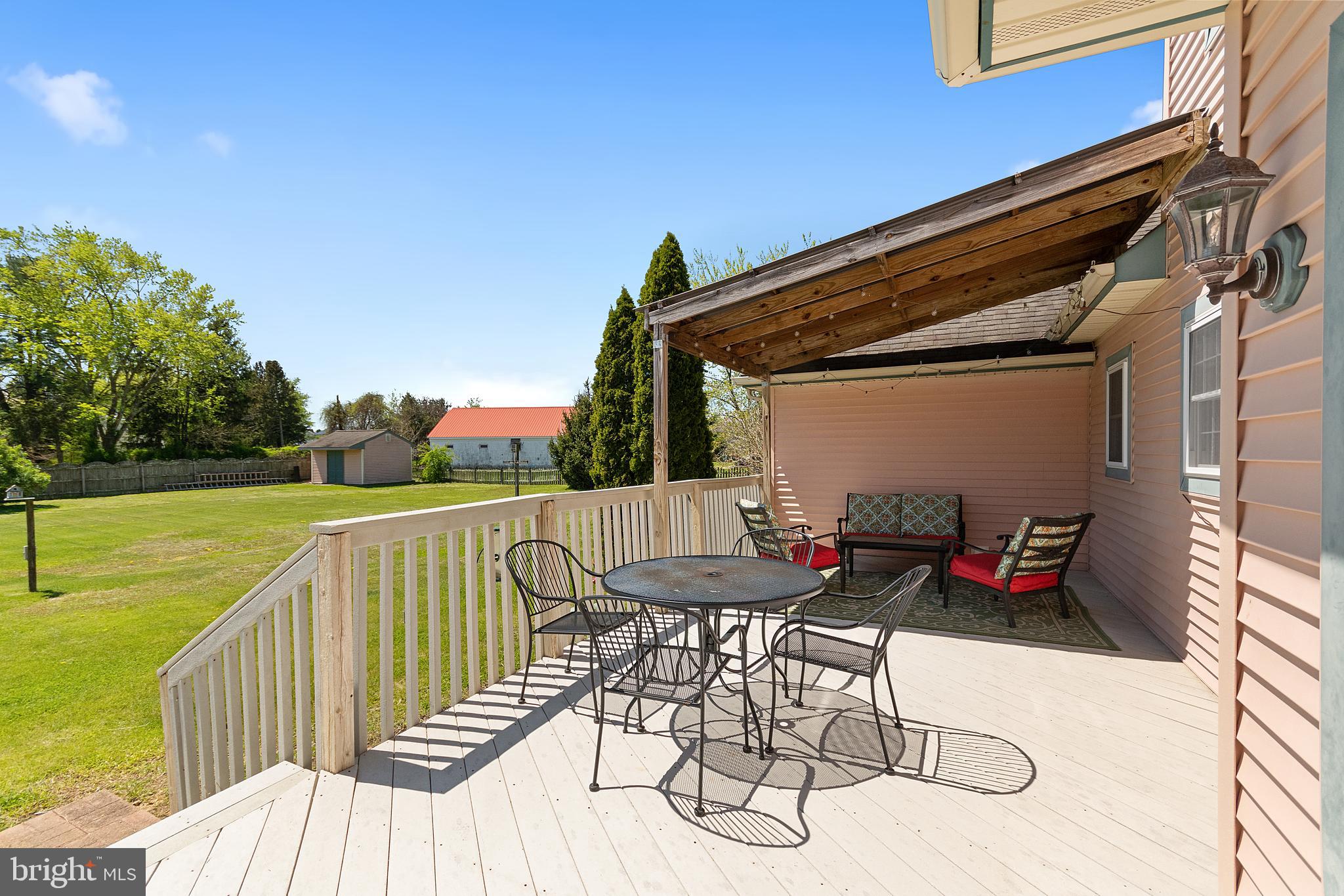 487 Radix Road Williamstown, NJ 08094 - Photo 34 of 36 a view of balcony with wooden floor outdoor seating and yard