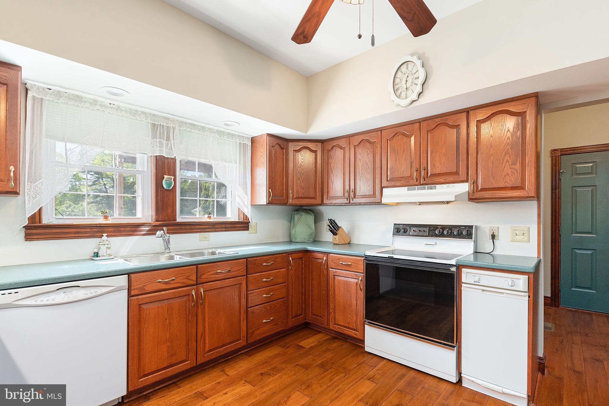 487 Radix Road Williamstown, NJ 08094 - Photo 9 of 36 a kitchen with stainless steel appliances granite countertop a stove and a sink
