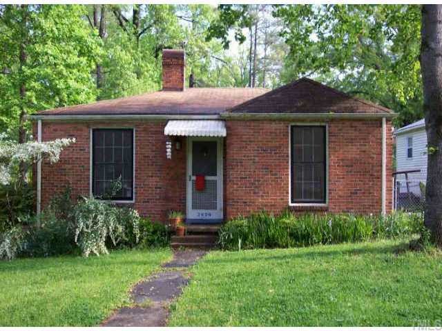2626 Bedford Avenue Raleigh, NC 27607 - Photo 1 of 1 a front view of a house with garden
