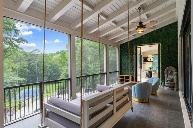 a living room with furniture potted plant a fireplace and a potted plant