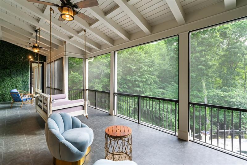 1430 North Harris Ridge Northwest Atlanta, GA 30327 - Photo 14 of 60 a living room with furniture and a floor to ceiling window