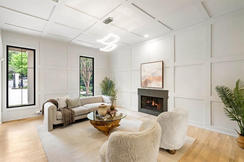 1430 North Harris Ridge Northwest Atlanta, GA 30327 - Photo 16 of 60 a living room with furniture fireplace and potted plants
