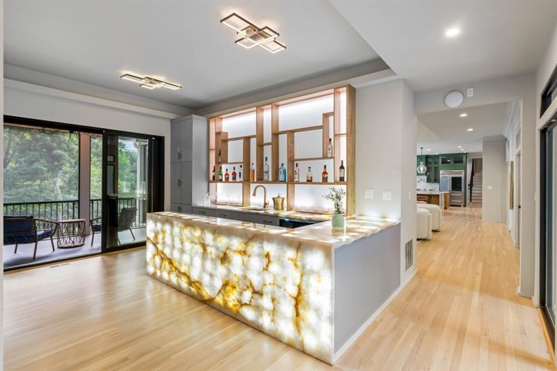 1430 North Harris Ridge Northwest Atlanta, GA 30327 - Photo 19 of 60 a large living room with large windows