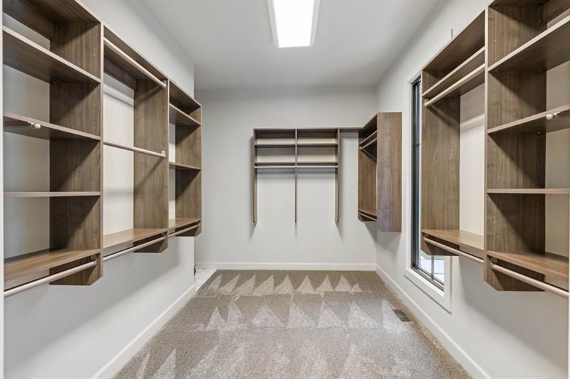 1430 North Harris Ridge Northwest Atlanta, GA 30327 - Photo 24 of 60 a view of walk in closet with empty racks