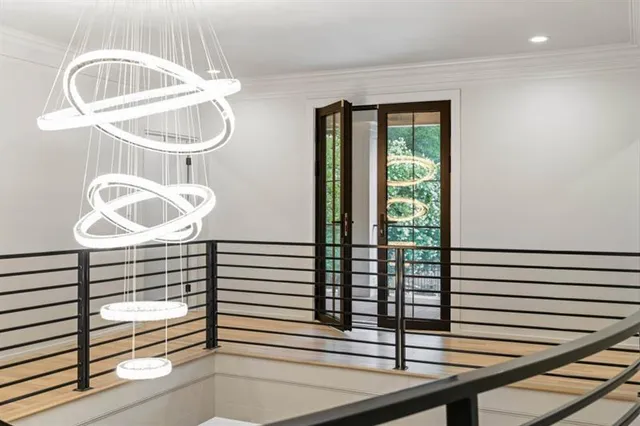 a large bedroom with a bed and a large mirror