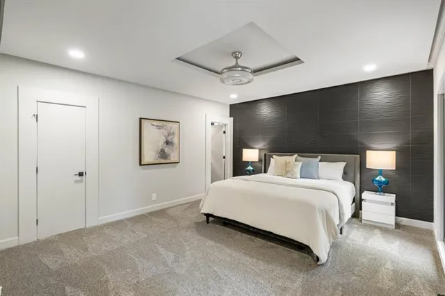 a bed room with a bed and a chandelier