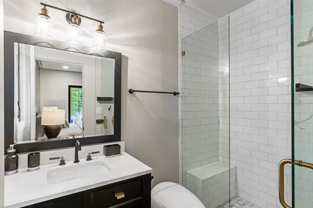 a bathroom with a sink vanity and mirror