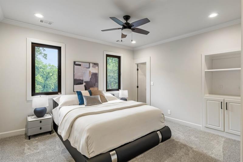 1430 North Harris Ridge Northwest Atlanta, GA 30327 - Photo 34 of 60 a bed room with a bed and a chandelier