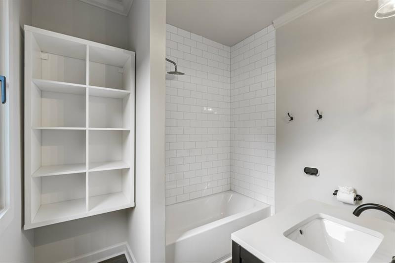 1430 North Harris Ridge Northwest Atlanta, GA 30327 - Photo 35 of 60 a bathroom with a sink a shower and a bathtub