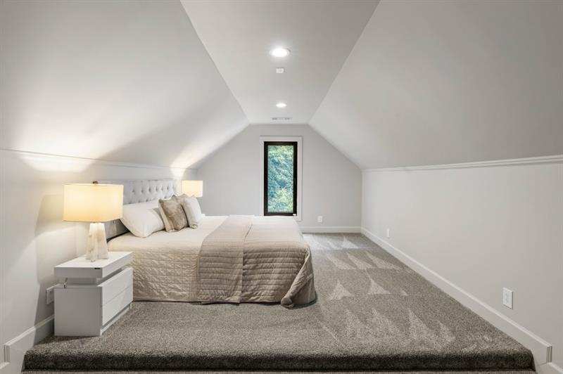 1430 North Harris Ridge Northwest Atlanta, GA 30327 - Photo 36 of 60 a bedroom with a bed and a window