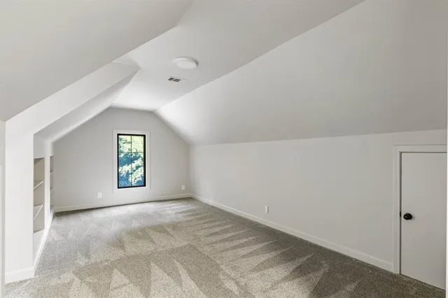 a kitchen with stainless steel appliances a sink stove and cabinets