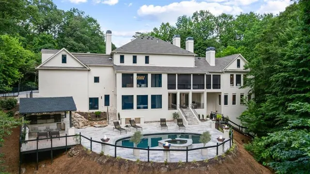 an aerial view of a house with outdoor space and street view