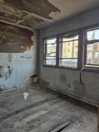 a kitchen with kitchen island a counter top space a sink stainless steel appliances and cabinets