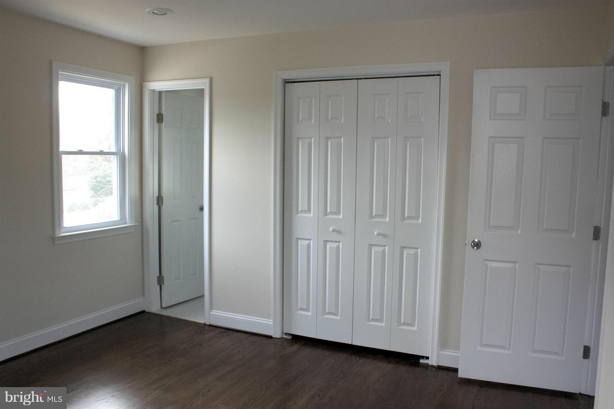 6709 Garvey Road Baltimore, MD 21237 - Photo 15 of 29 an empty room with wooden floor