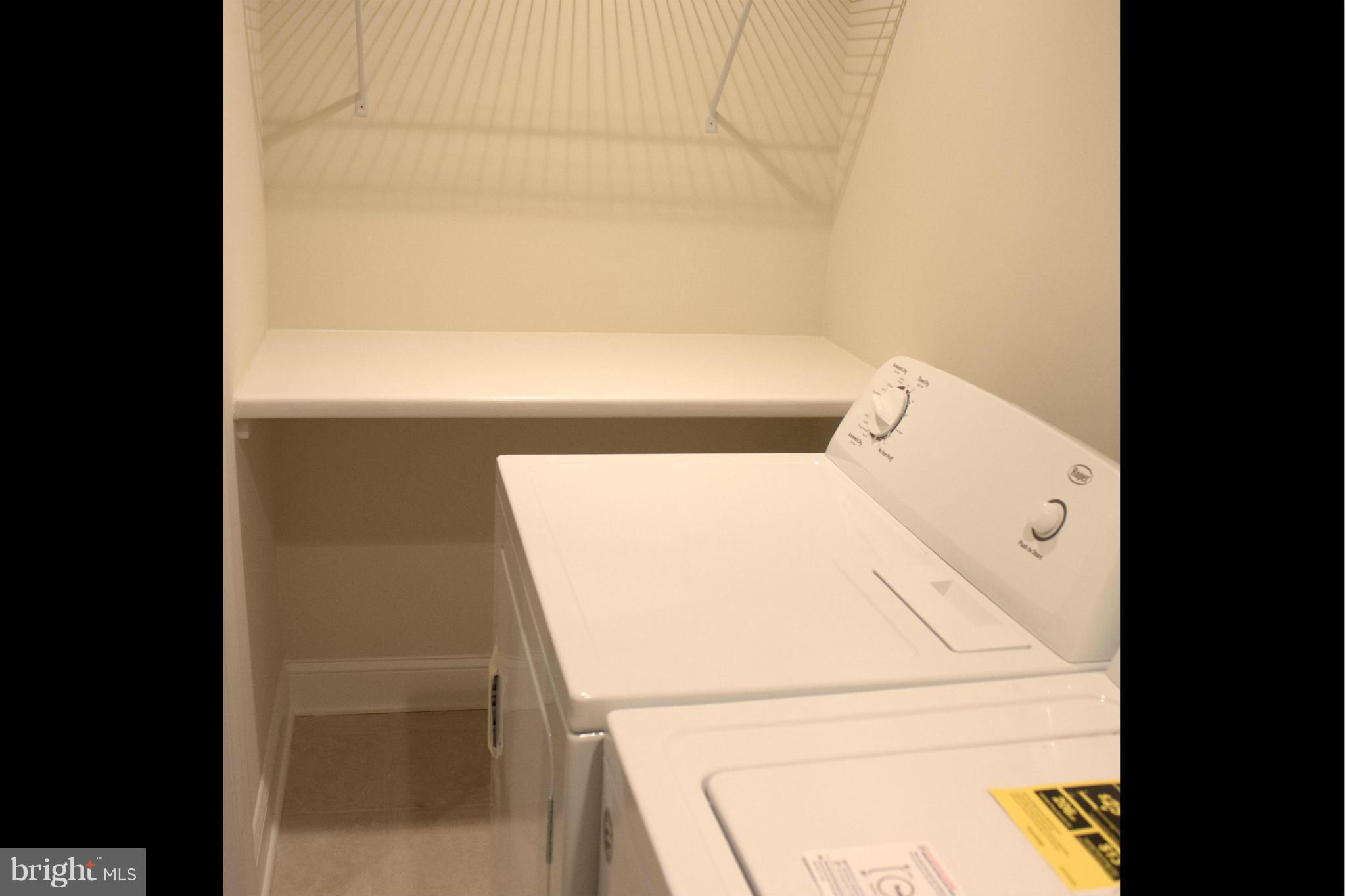 6709 Garvey Road Baltimore, MD 21237 - Photo 26 of 29 a utility room with dryer and washer