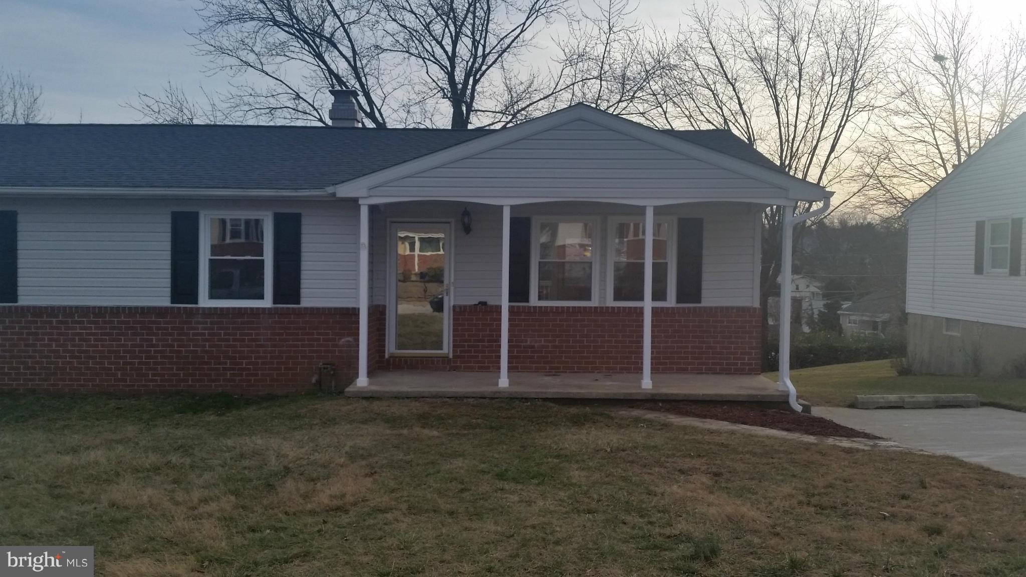6709 Garvey Road Baltimore, MD 21237 - Photo 29 of 29 front view of a house with a yard