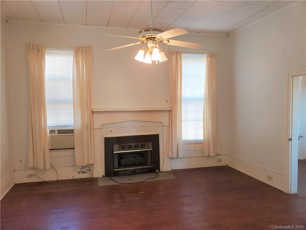 8131 Oak Tree Road Sharon, SC 29742 - Photo 16 of 36 an empty room with windows and fireplace