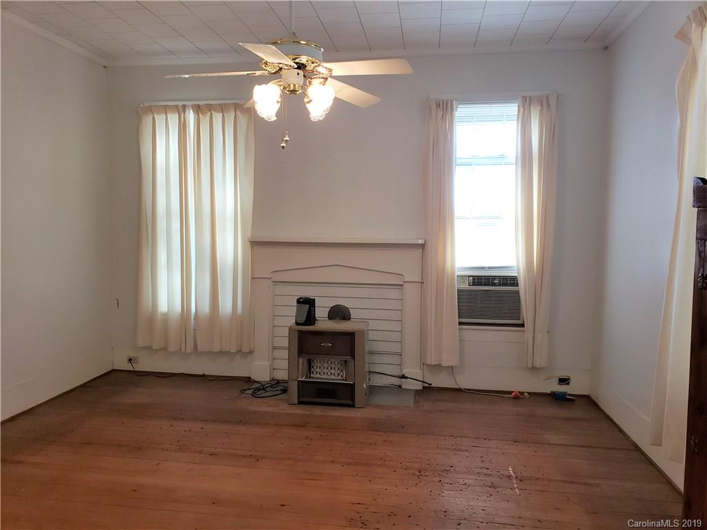 8131 Oak Tree Road Sharon, SC 29742 - Photo 17 of 36 an empty room with windows and fan