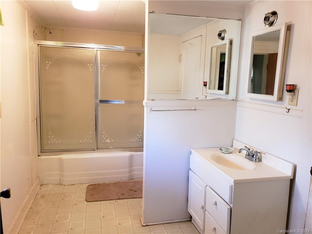 8131 Oak Tree Road Sharon, SC 29742 - Photo 21 of 36 a bathroom with a sink and a mirror
