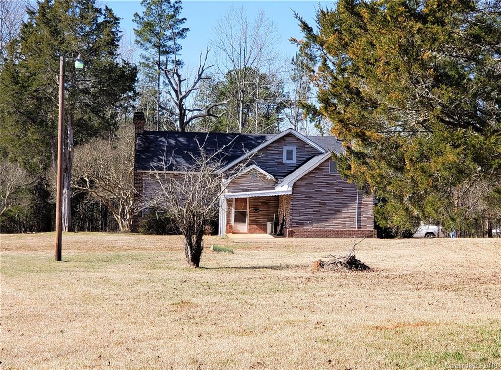 8131 Oak Tree Road Sharon, SC 29742 - Photo 4 of 36 a house with trees in front of it
