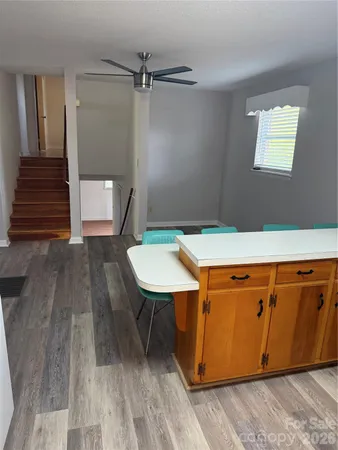 a dining room with a table and chairs
