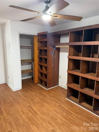 a view of an empty room with empty shelves