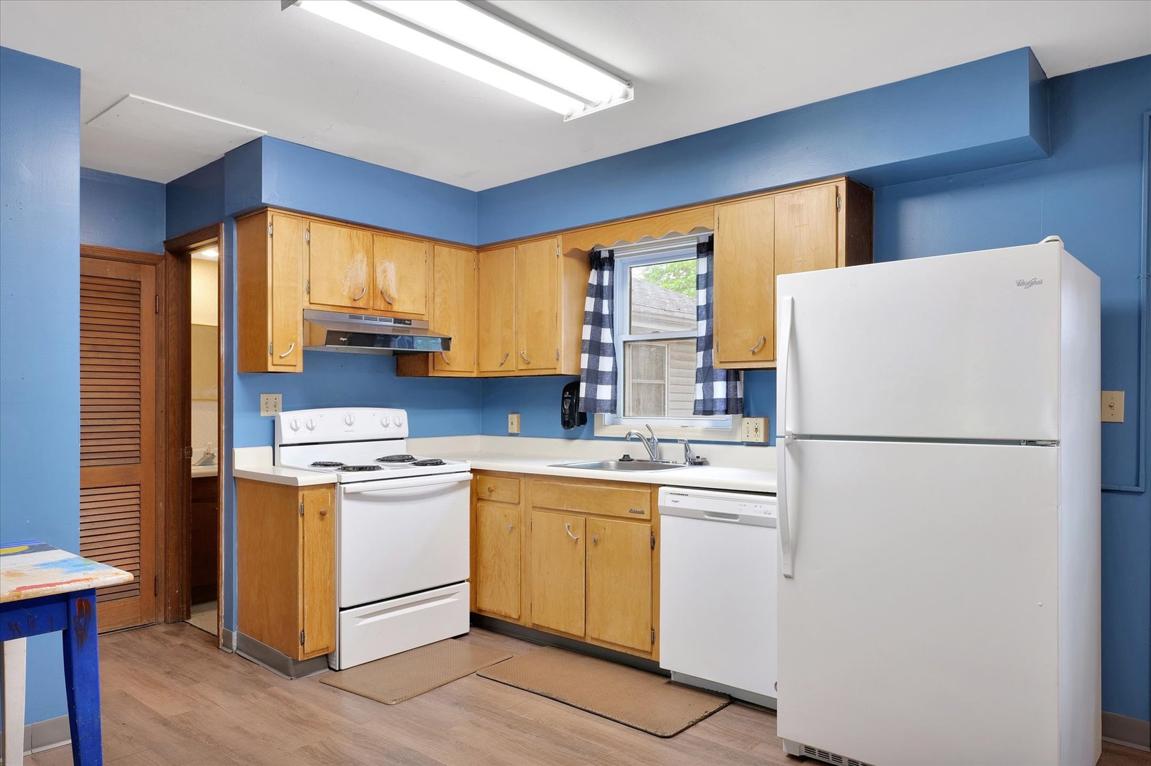 1705 Georgetown Drive Champaign, IL 61821 - Photo 12 of 44 a white refrigerator freezer sitting inside of a kitchen