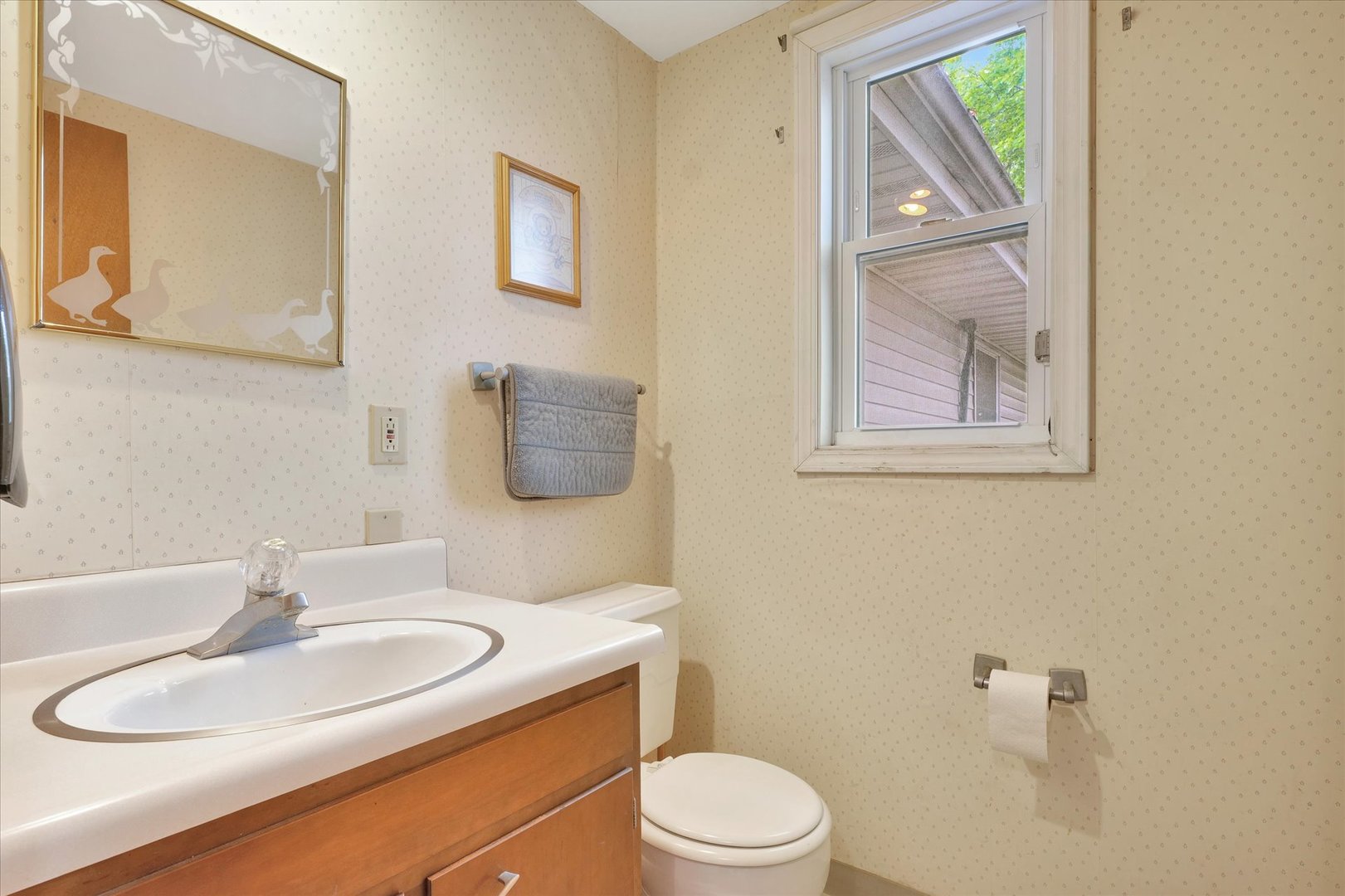 1705 Georgetown Drive Champaign, IL 61821 - Photo 17 of 44 a bathroom with a granite countertop toilet a sink and mirror