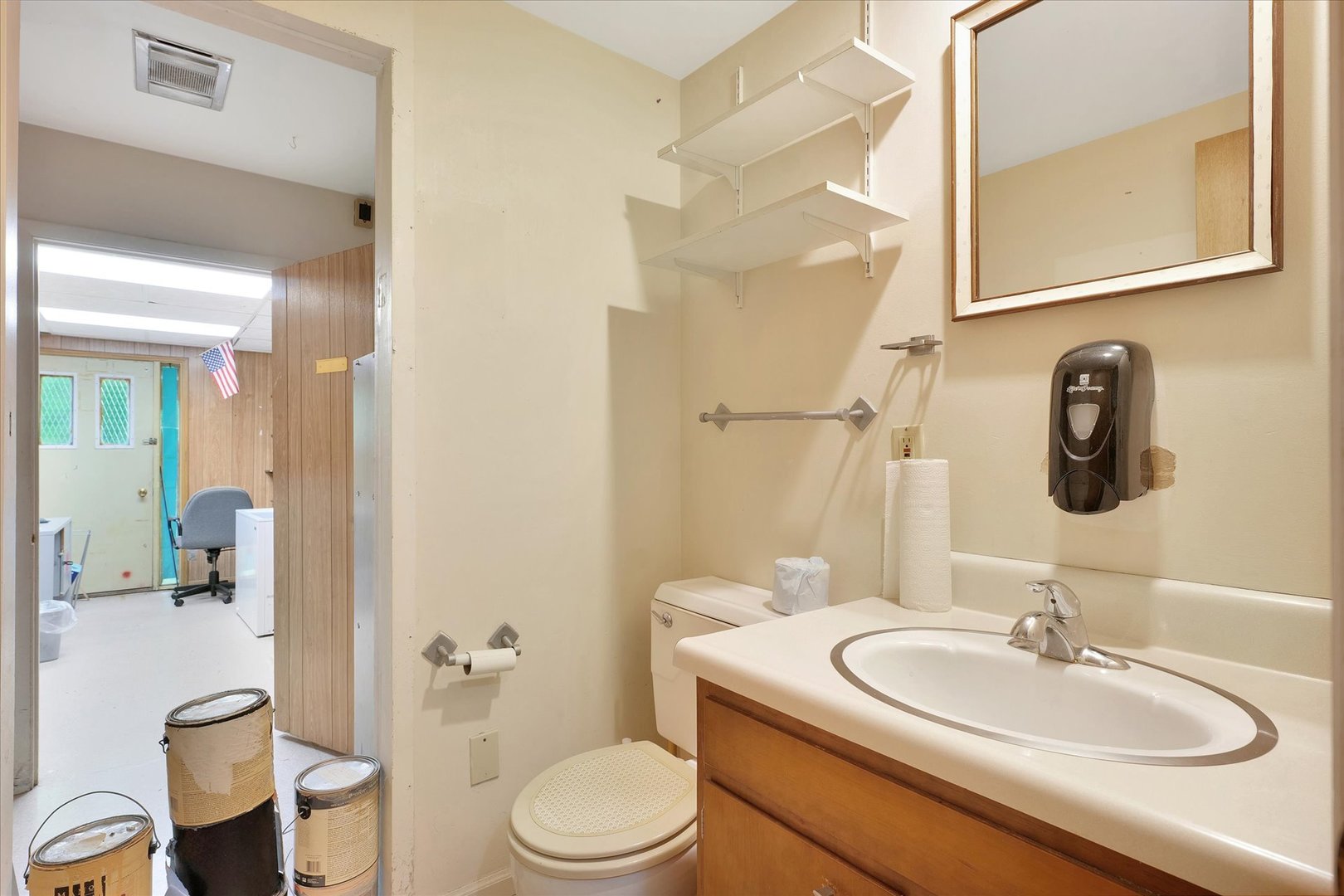 1705 Georgetown Drive Champaign, IL 61821 - Photo 21 of 44 a bathroom with a toilet sink and mirror