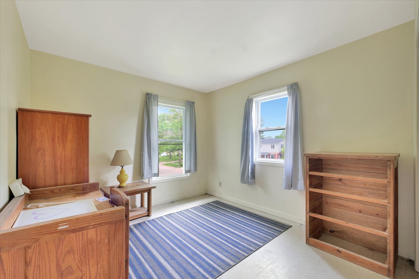 1705 Georgetown Drive Champaign, IL 61821 - Photo 26 of 44 a living room with furniture a window and a dresser
