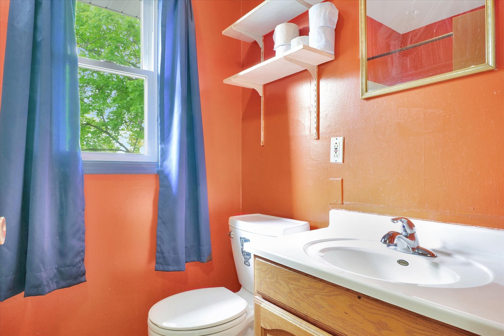 1705 Georgetown Drive Champaign, IL 61821 - Photo 30 of 44 a bathroom with a toilet sink and mirror