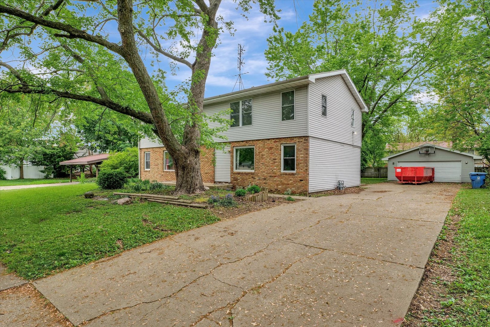1705 Georgetown Drive Champaign, IL 61821 - Photo 3 of 44 a front view of a house with a yard and garage