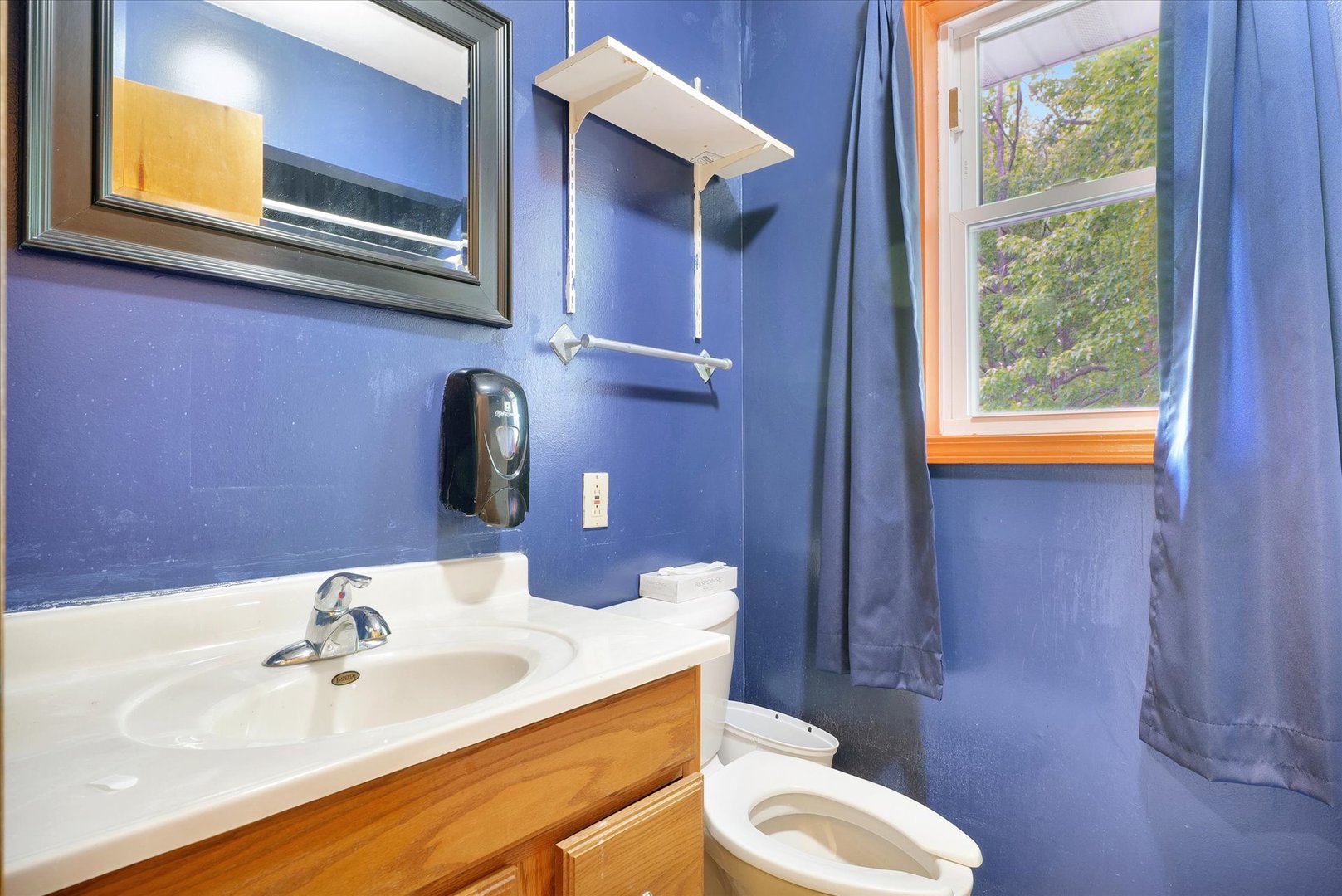 1705 Georgetown Drive Champaign, IL 61821 - Photo 31 of 44 a bathroom with a sink a toilet and mirror