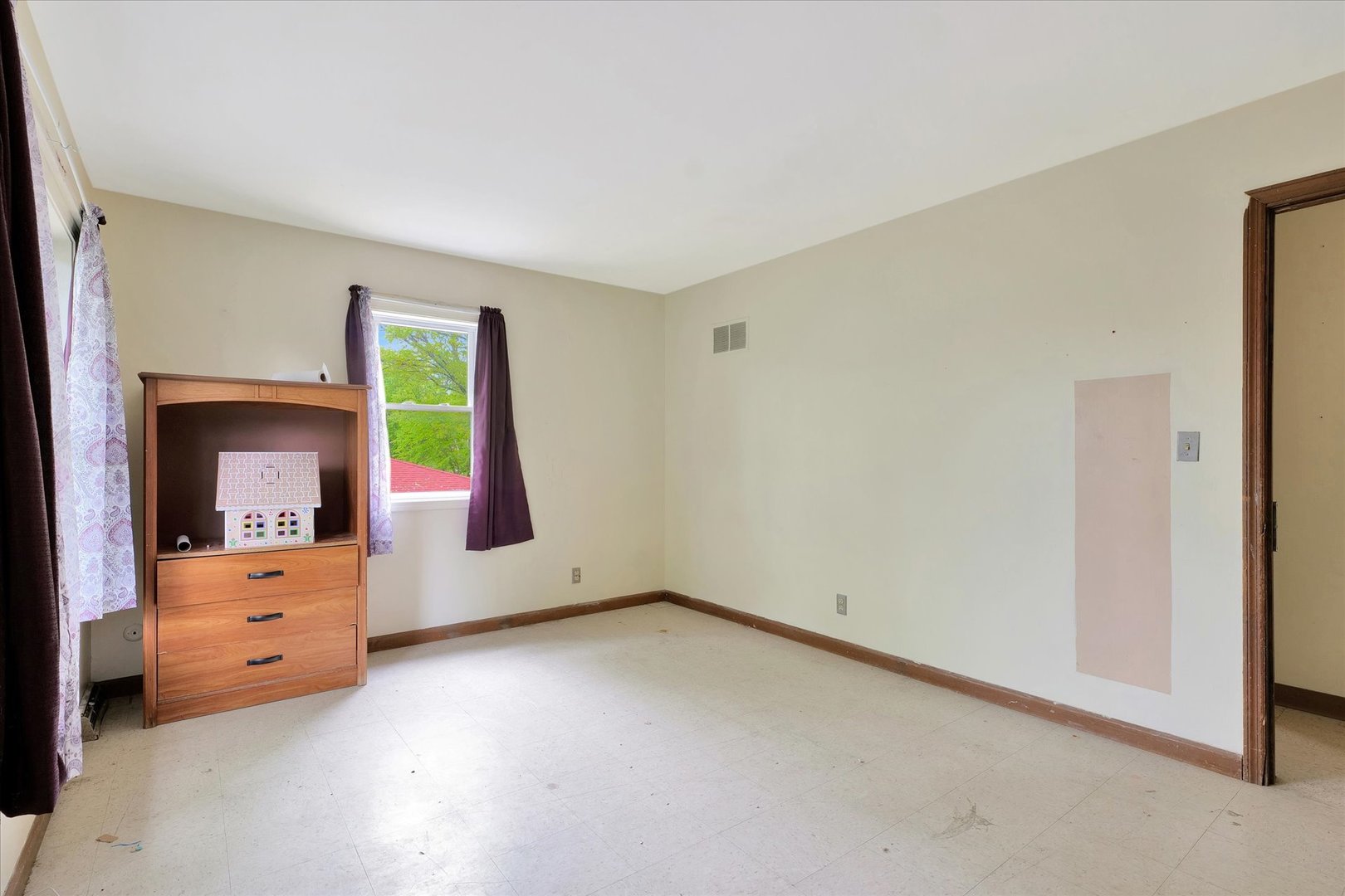 1705 Georgetown Drive Champaign, IL 61821 - Photo 35 of 44 an empty room with a dresser and mirror