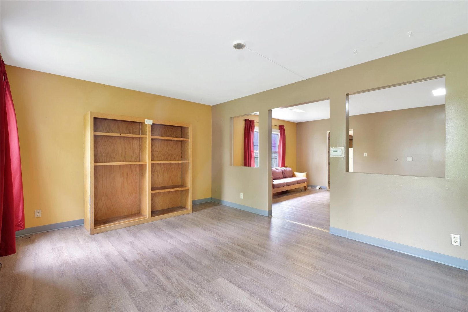 1705 Georgetown Drive Champaign, IL 61821 - Photo 5 of 44 a view of an empty room with wooden floor and a window