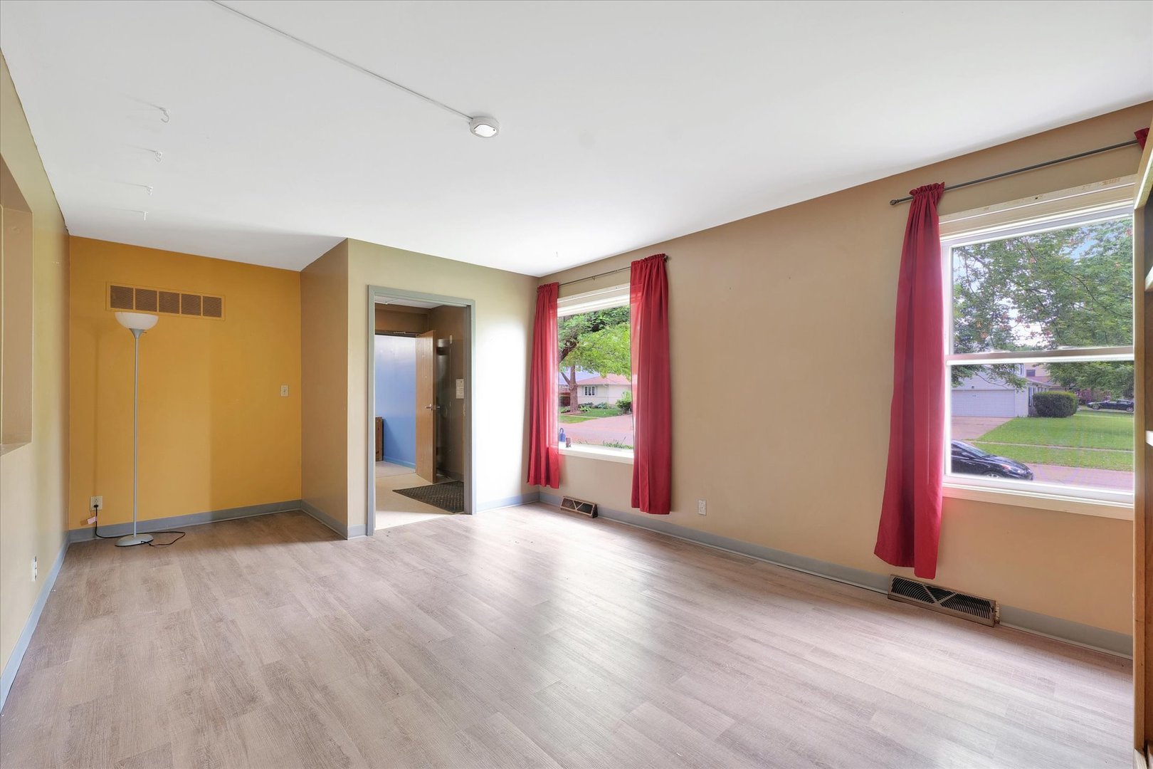 1705 Georgetown Drive Champaign, IL 61821 - Photo 6 of 44 an empty room with wooden floor and windows