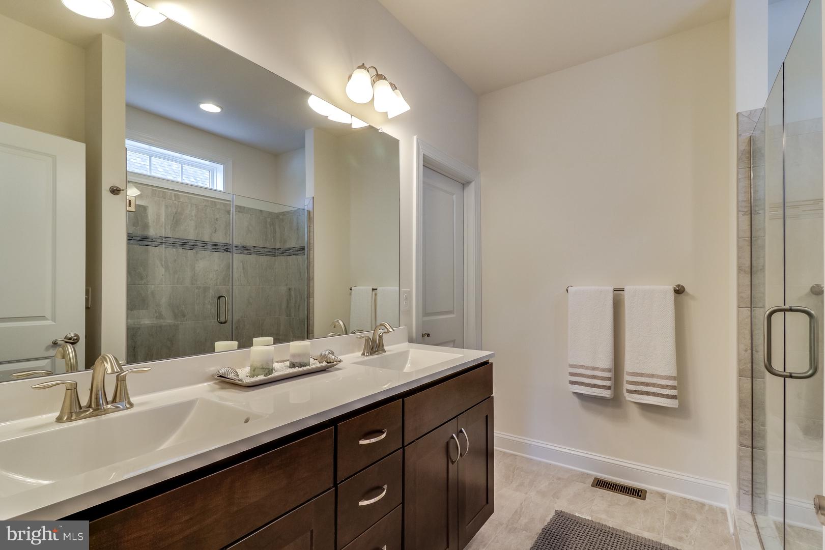 319 Valley Road Milton, DE 19968 - Photo 17 of 36 Master bath with dual vanity, tile shower