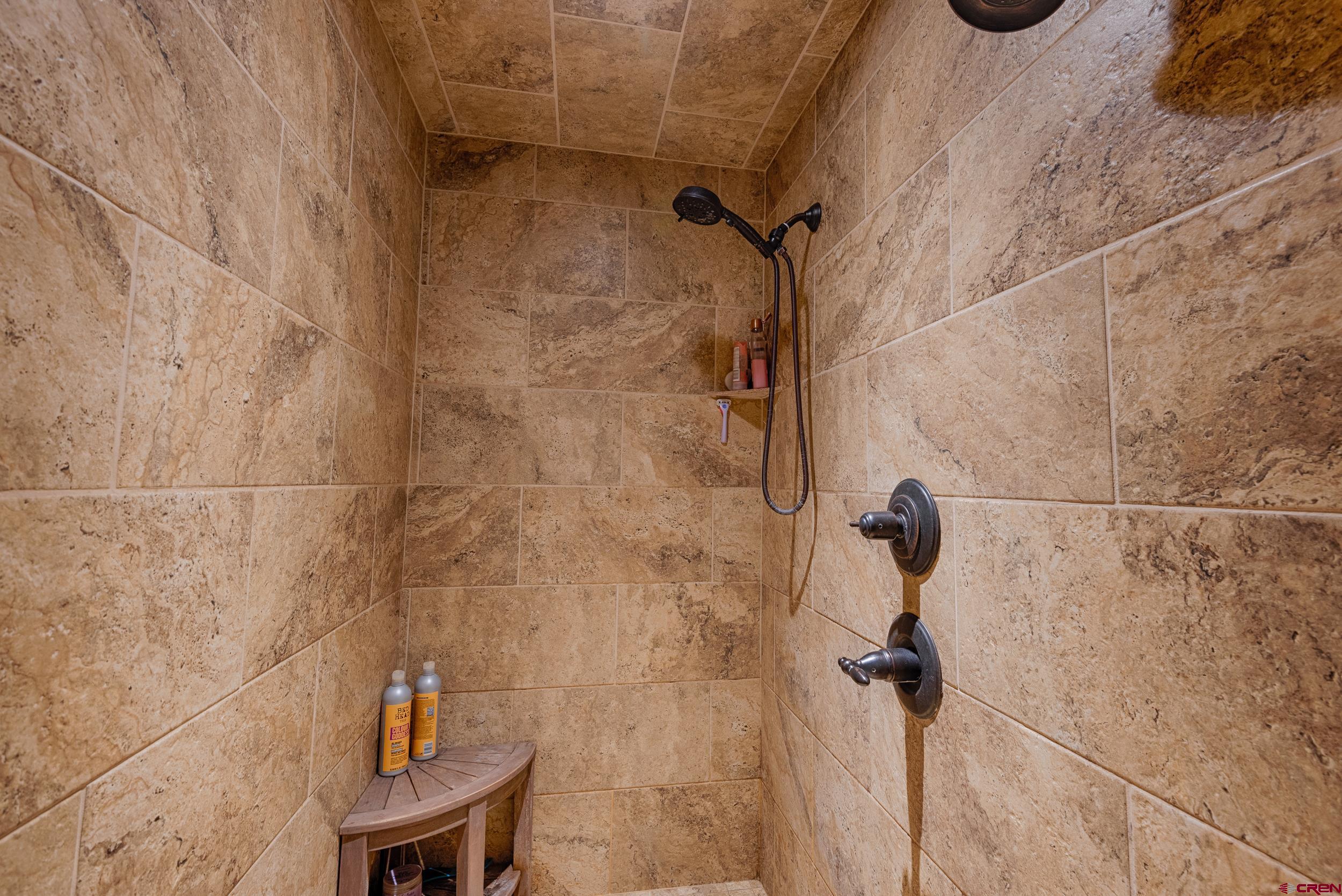 13287 6160th Road Montrose, CO 81403 - Photo 11 of 35 a bathroom with a granite countertop shower