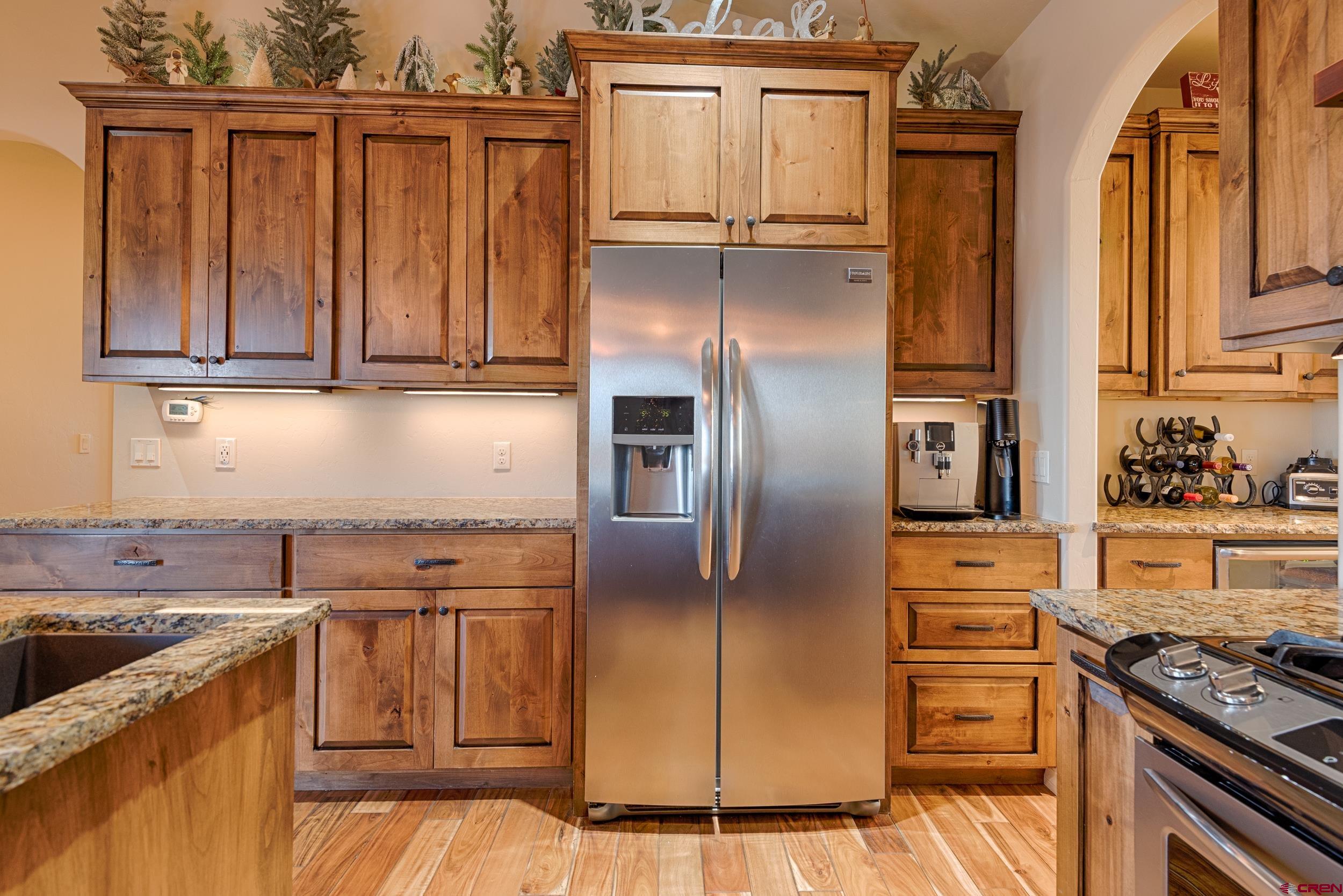 13287 6160th Road Montrose, CO 81403 - Photo 16 of 35 a kitchen with stainless steel appliances granite countertop a refrigerator stove and sink