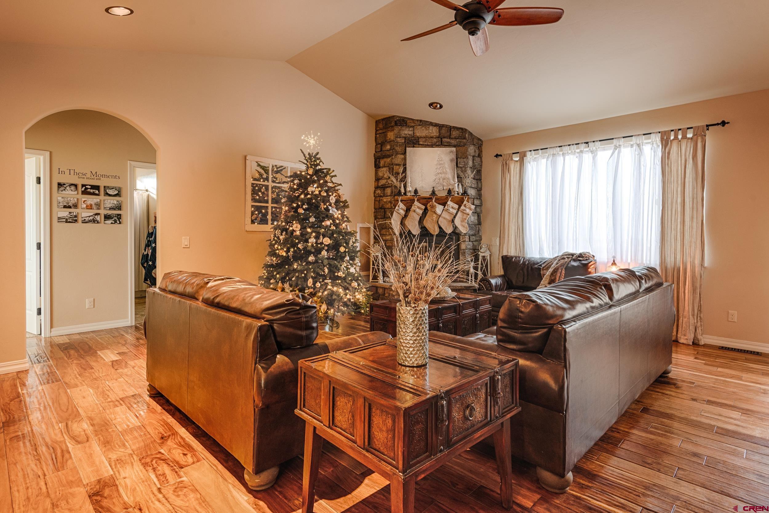 13287 6160th Road Montrose, CO 81403 - Photo 18 of 35 a living room with furniture a window and a chandelier