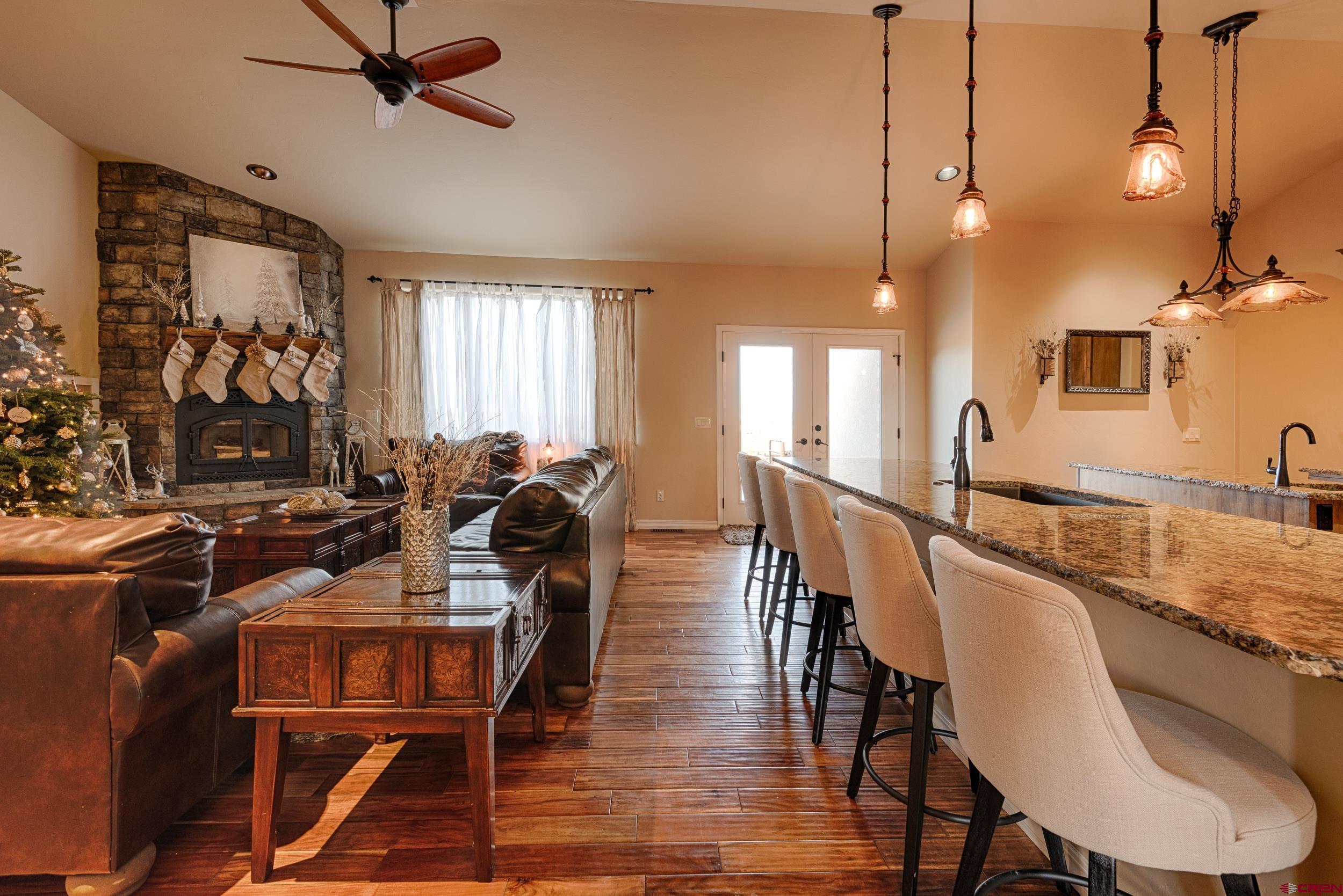 13287 6160th Road Montrose, CO 81403 - Photo 19 of 35 a view of a dining room with furniture and a chandelier