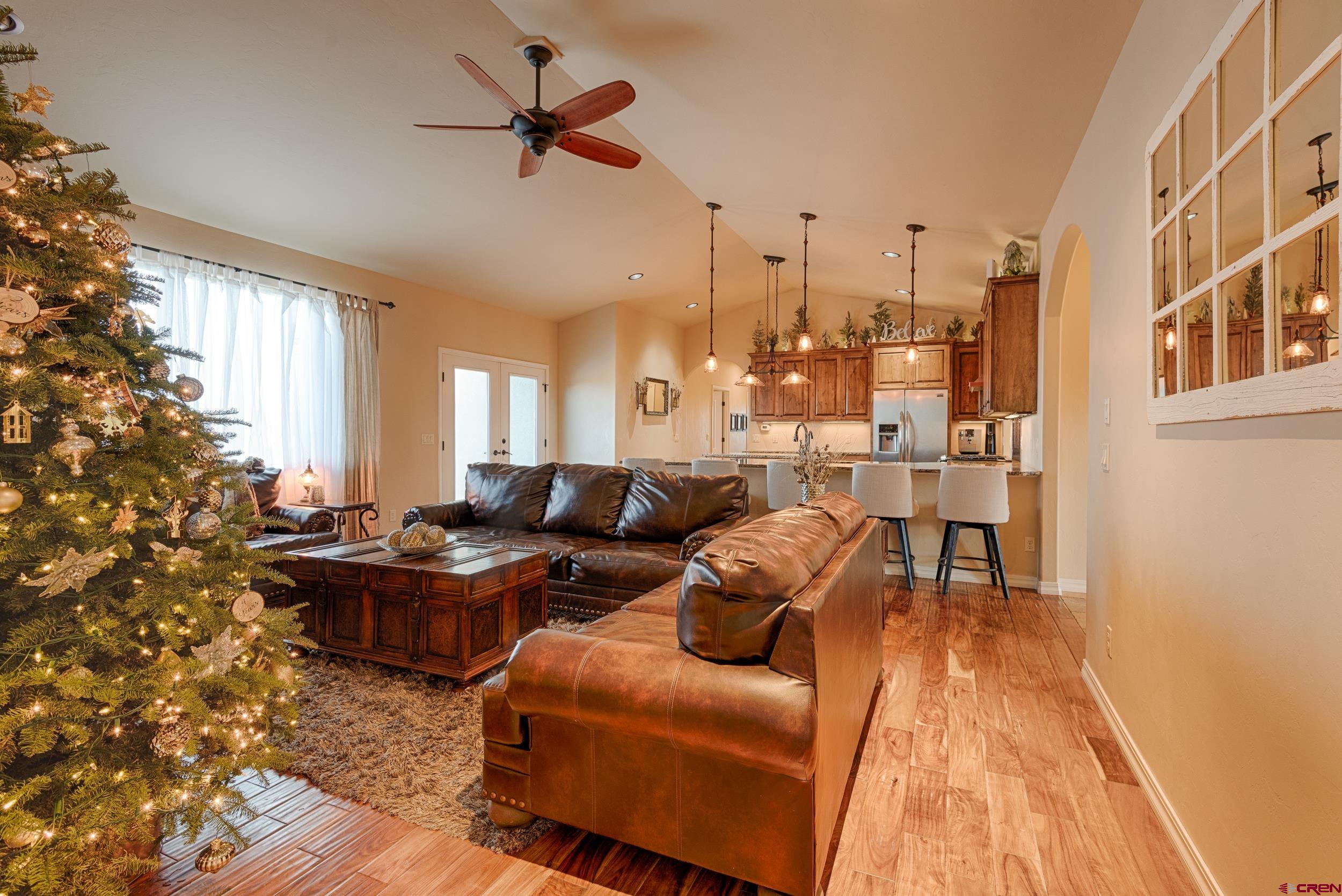 13287 6160th Road Montrose, CO 81403 - Photo 21 of 35 a living room with fireplace furniture and a rug